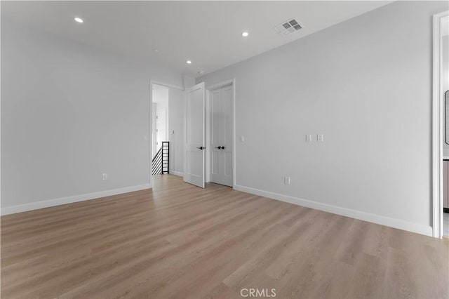 unfurnished room featuring light wood-type flooring