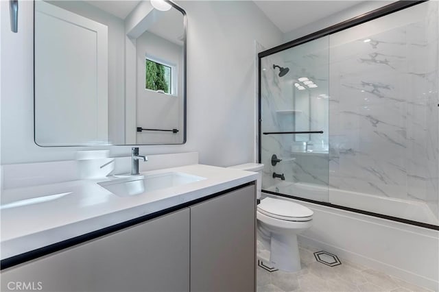 full bathroom featuring shower / bath combination with glass door, tile patterned floors, vanity, and toilet