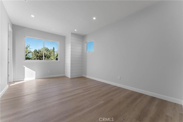 spare room featuring light hardwood / wood-style floors