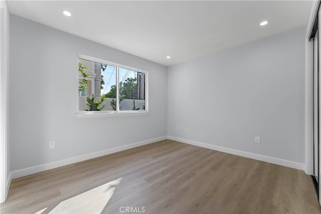 unfurnished room featuring light hardwood / wood-style flooring