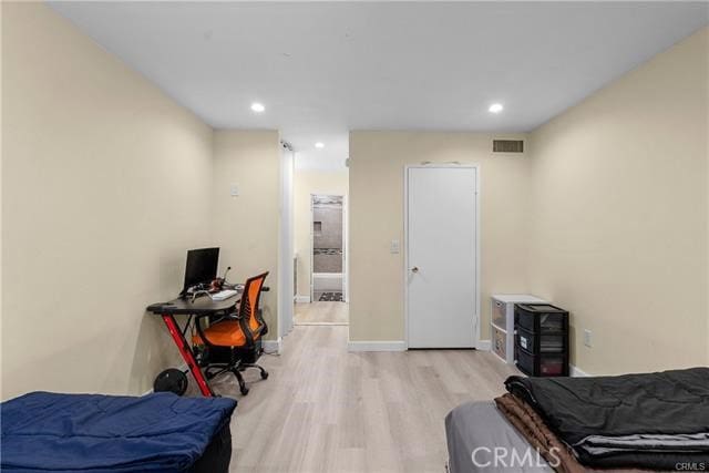 bedroom with light hardwood / wood-style flooring