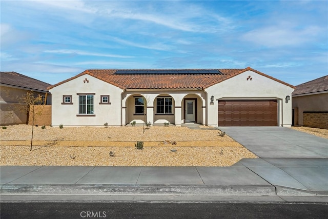 mediterranean / spanish-style house featuring a garage