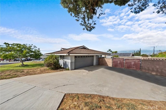 view of side of property featuring a garage