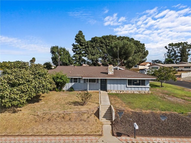 ranch-style house with a front yard