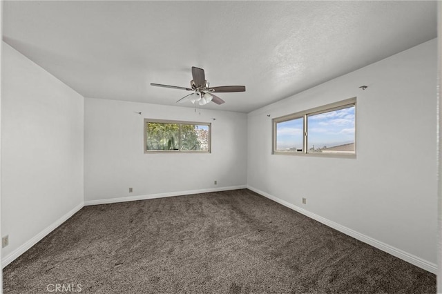 spare room with carpet flooring and ceiling fan