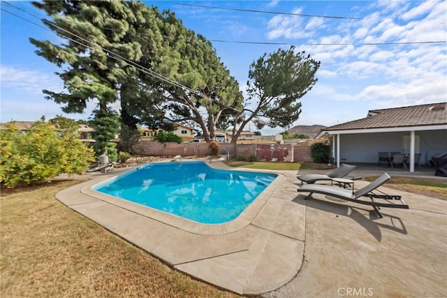 view of swimming pool with a patio area