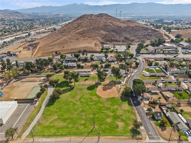 birds eye view of property with a mountain view