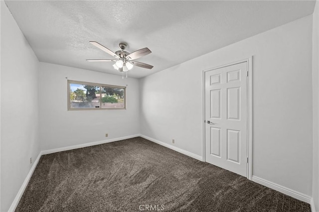 carpeted empty room with a textured ceiling and ceiling fan