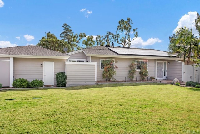 ranch-style house featuring a front lawn