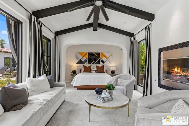 bedroom with light carpet and lofted ceiling with beams