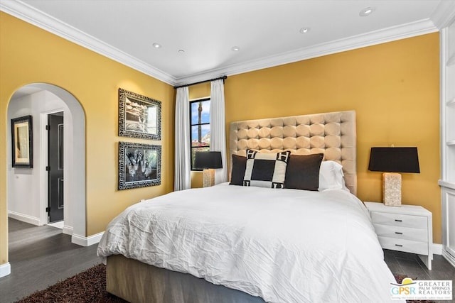 bedroom with dark hardwood / wood-style floors and crown molding