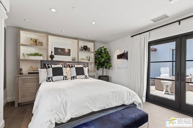 bedroom with light hardwood / wood-style floors, french doors, and access to outside