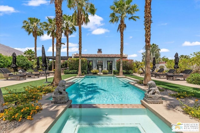 view of pool with a patio area and an outdoor structure