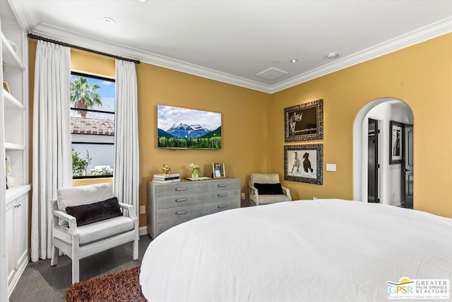 bedroom with dark carpet and ornamental molding