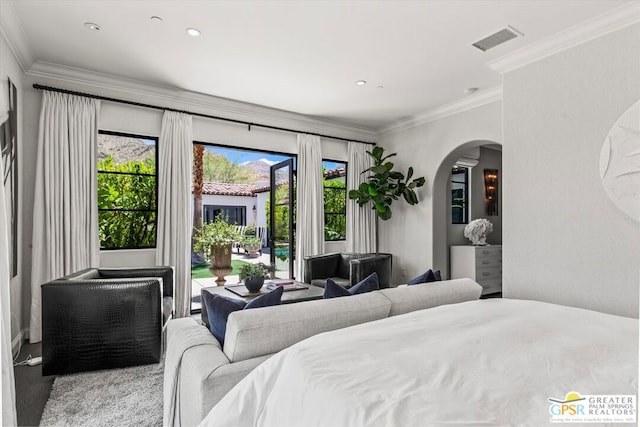 bedroom with access to outside, crown molding, and multiple windows