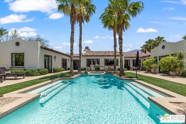 view of swimming pool featuring a patio area