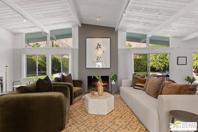 sunroom / solarium with plenty of natural light and lofted ceiling with beams