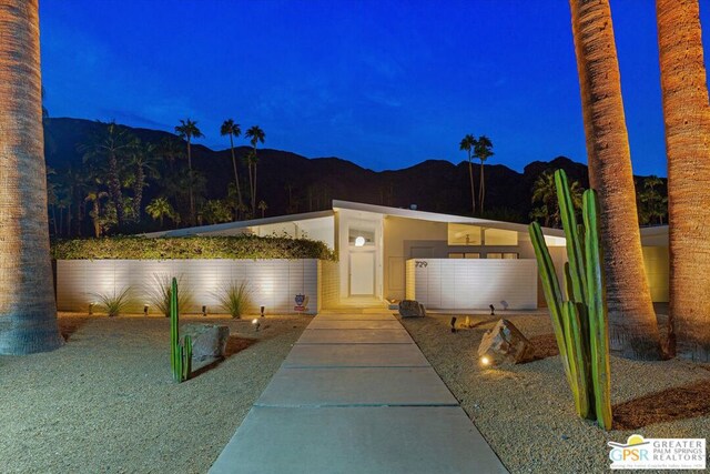 view of front of home with a mountain view