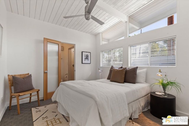 carpeted bedroom with ceiling fan and lofted ceiling with beams