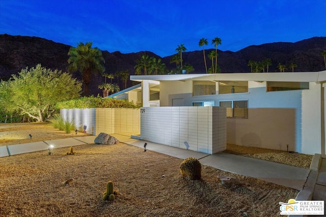 view of property exterior featuring a mountain view