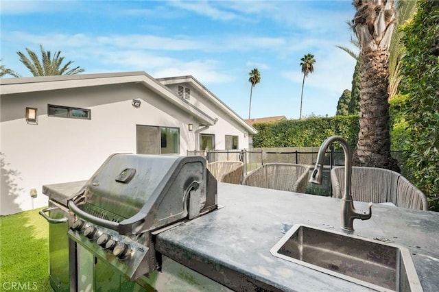 view of patio / terrace with area for grilling and sink