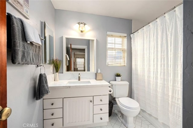 bathroom with tile patterned floors, vanity, toilet, and a shower with curtain