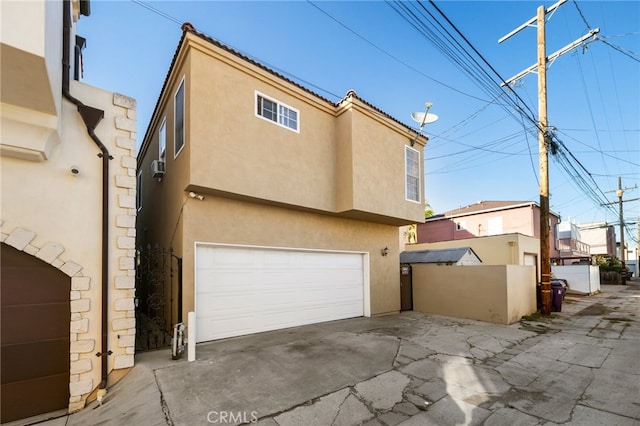 back of property featuring a garage