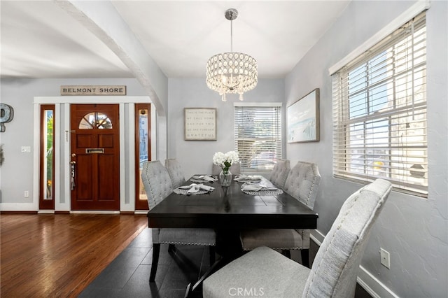 dining room featuring a chandelier and dark hardwood / wood-style flooring