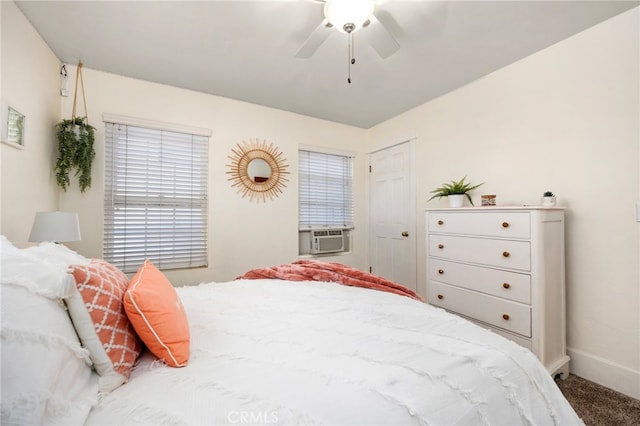 carpeted bedroom featuring ceiling fan and cooling unit