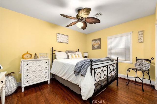 bedroom with dark wood-type flooring and ceiling fan