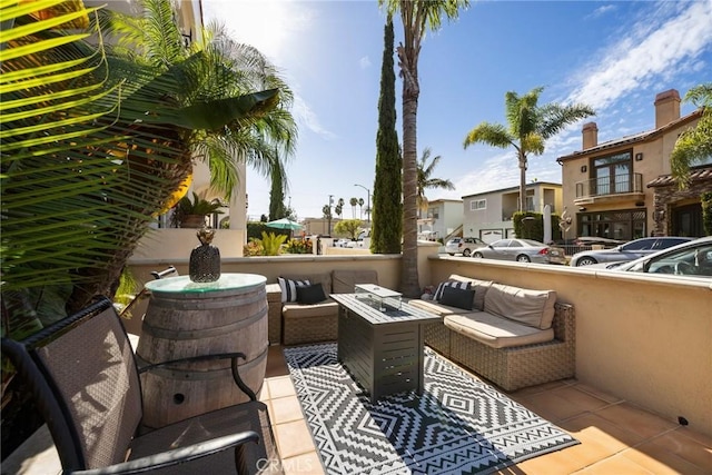 view of patio / terrace featuring an outdoor living space with a fire pit