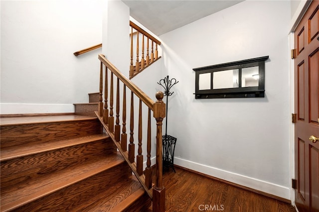 staircase featuring hardwood / wood-style floors