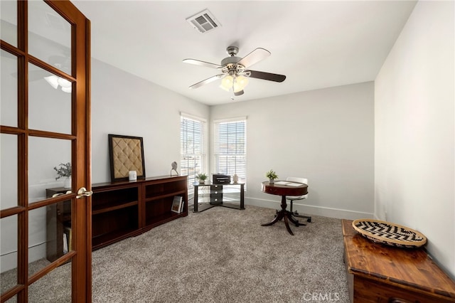 sitting room with french doors, carpet, and ceiling fan