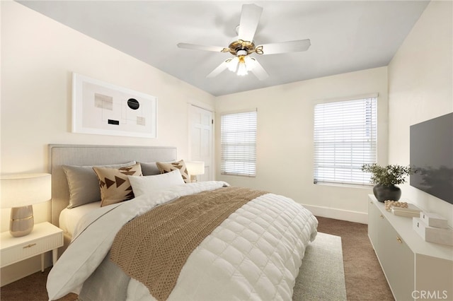 bedroom featuring carpet, baseboards, and a ceiling fan