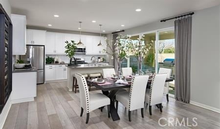 dining room with light wood-type flooring