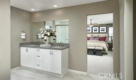 bathroom with vanity and ceiling fan