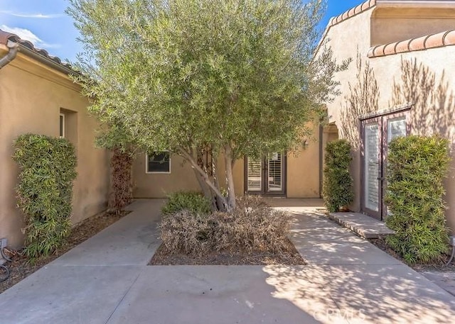 property entrance with a patio