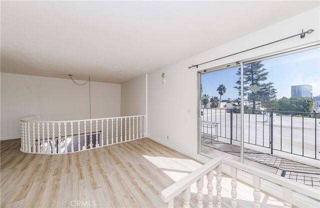 unfurnished room with light wood-type flooring