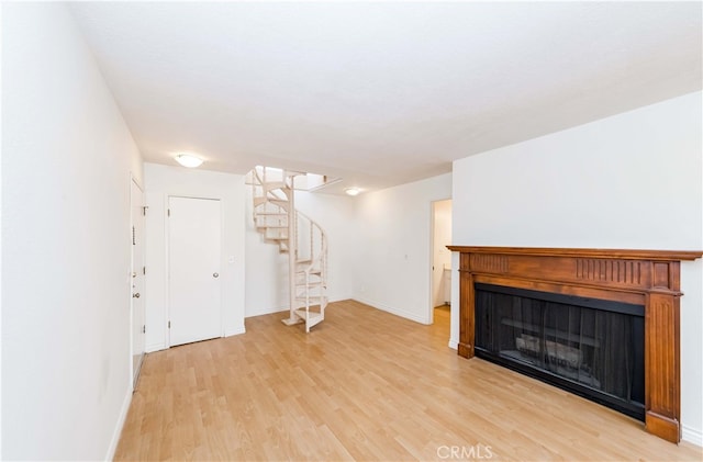 unfurnished living room with light hardwood / wood-style flooring