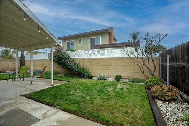13503 Fidler Ave, Bellflower, CA 90706 - fenced backyard featuring a patio