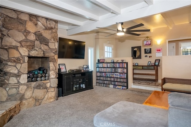 13503 Fidler Ave, Bellflower, CA 90706 - carpeted living area featuring ceiling fan, beamed ceiling, and a large fireplace