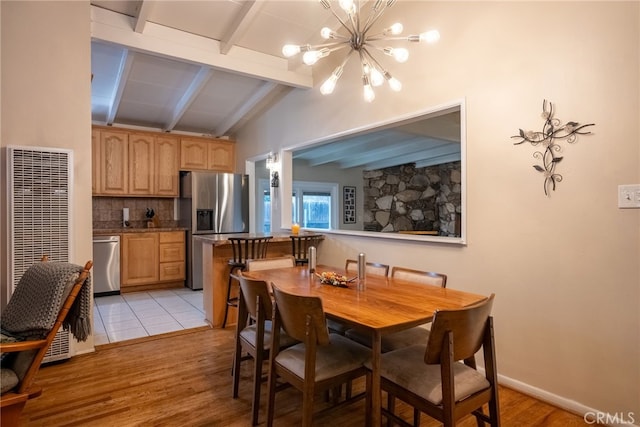13503 Fidler Ave, Bellflower, CA 90706 - dining room featuring a heating unit, a chandelier, and light wood-type flooring