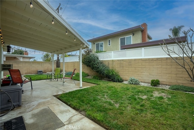 13503 Fidler Ave, Bellflower, CA 90706 - fenced backyard with a patio area