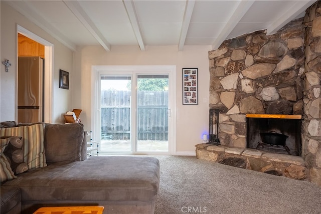 13503 Fidler Ave, Bellflower, CA 90706 - living room featuring beamed ceiling, carpet, and a stone fireplace