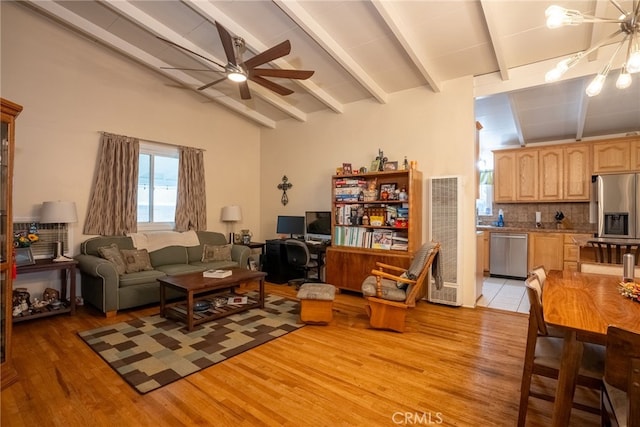13503 Fidler Ave, Bellflower, CA 90706 - living room featuring a heating unit, a ceiling fan, and light wood-style floors