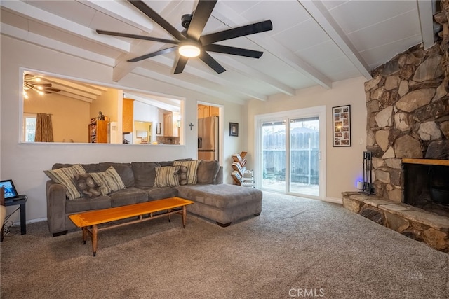 13503 Fidler Ave, Bellflower, CA 90706 - living area with ceiling fan, carpet flooring, a stone fireplace, and plenty of natural light
