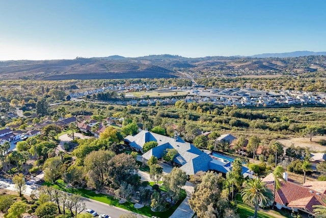 birds eye view of property with a mountain view