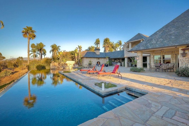 view of pool featuring a patio