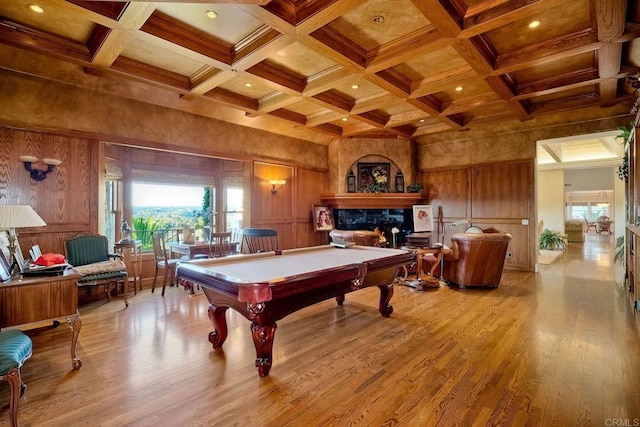 playroom featuring beamed ceiling, light hardwood / wood-style flooring, wood walls, and pool table