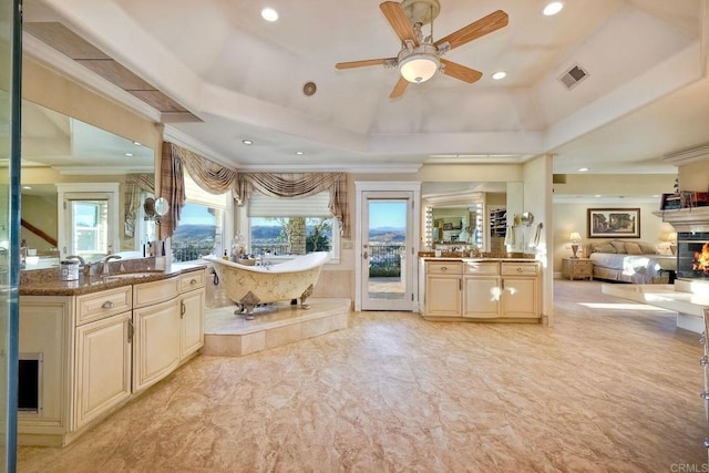 31350 Lake Vista Cir, Bonsall, CA 92003 - bathroom featuring ceiling fan, a freestanding tub, ornamental molding, two vanities, and recessed lighting